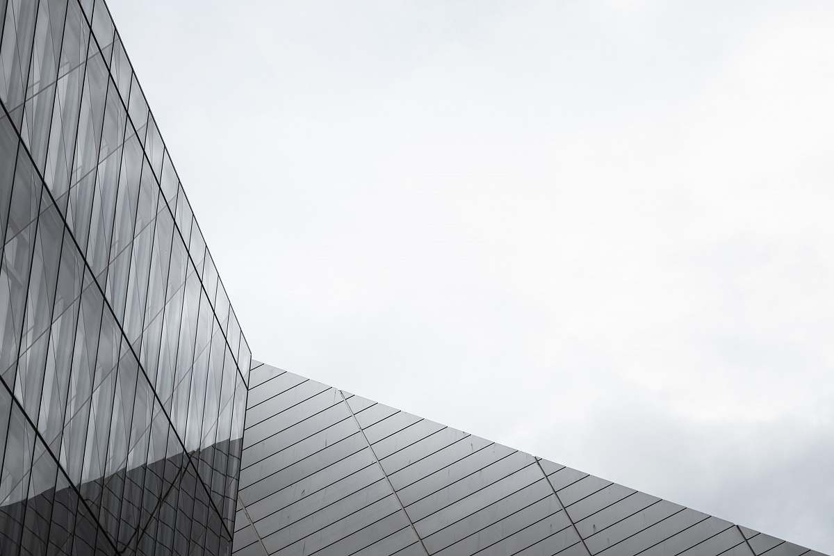 office building gray metal and glass building city